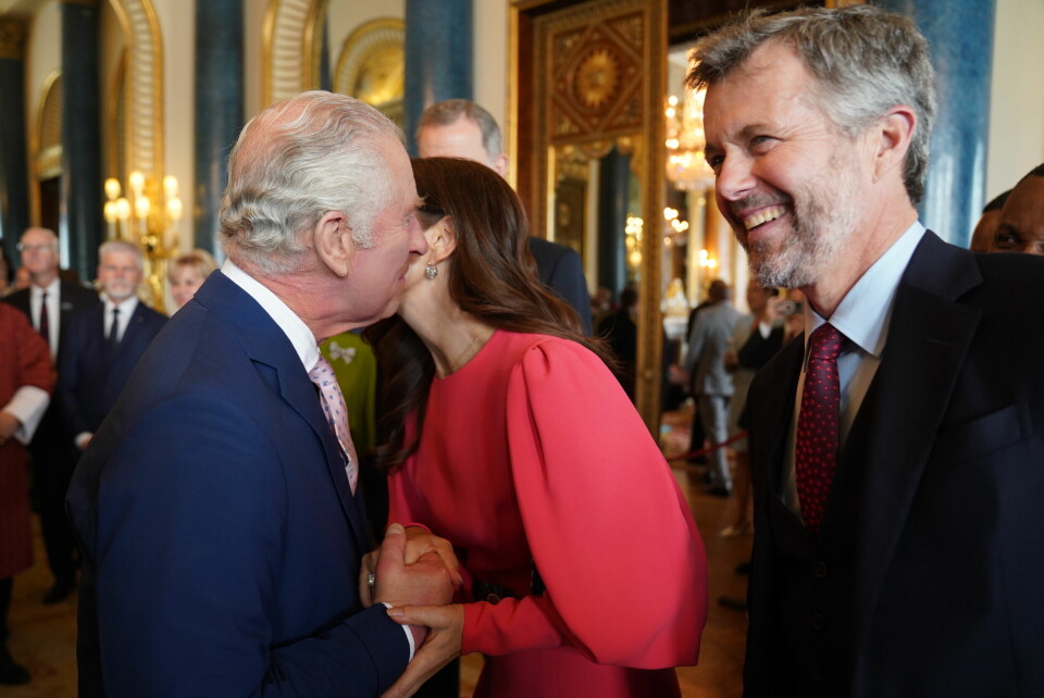 LONDON, ENGLAND - MAY 05: King Charles III (L) greets Mary, Crown Princess of Denmark and Crown Prince Frederik of Denmark during a reception at Buckingham Palace for overseas guests attending the coronation of King Charles III on May 5, 2023 in London, England. (Photo by Jacob King - WPA Pool / Getty Images)